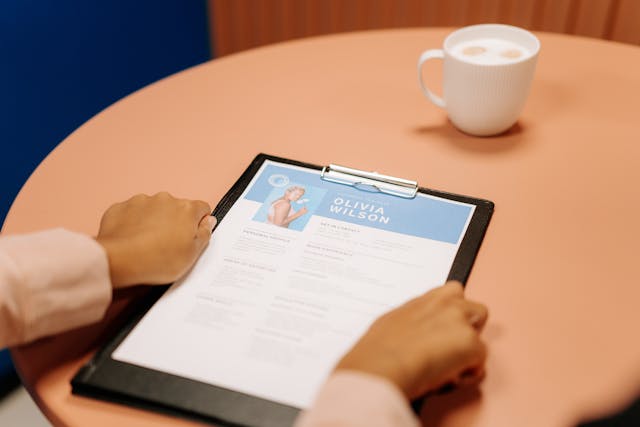 person-holding-black-tablet-computer